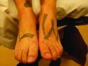 Figure. “LW” is a gang affiliation meant to be seen when wearing sandals.